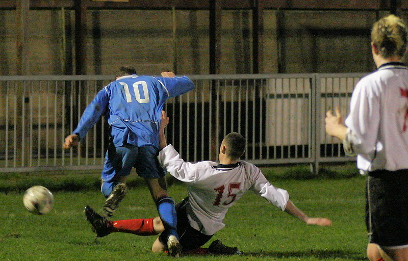 Mark Livermore gets the ball away from Darren Annis
