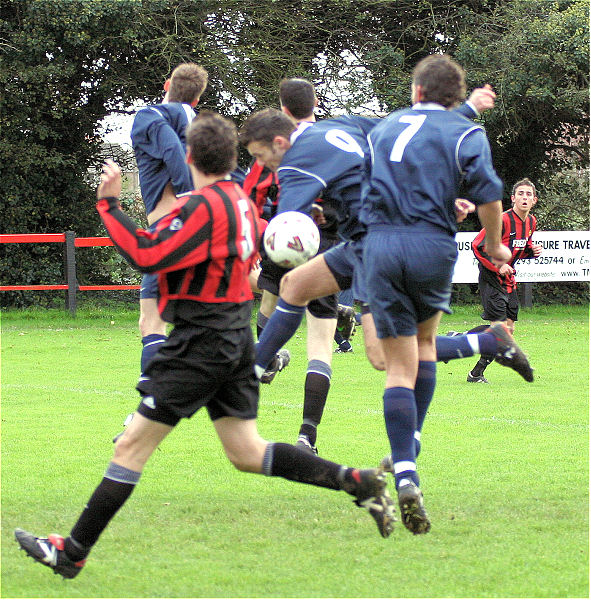 Dave Walker (9) and Jason Wimbleton (7) are involved in this mad scramble for the ball
