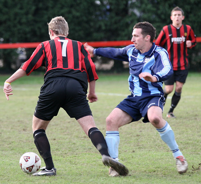 Mike Duffell (7) takes on Dave Ward (?)
