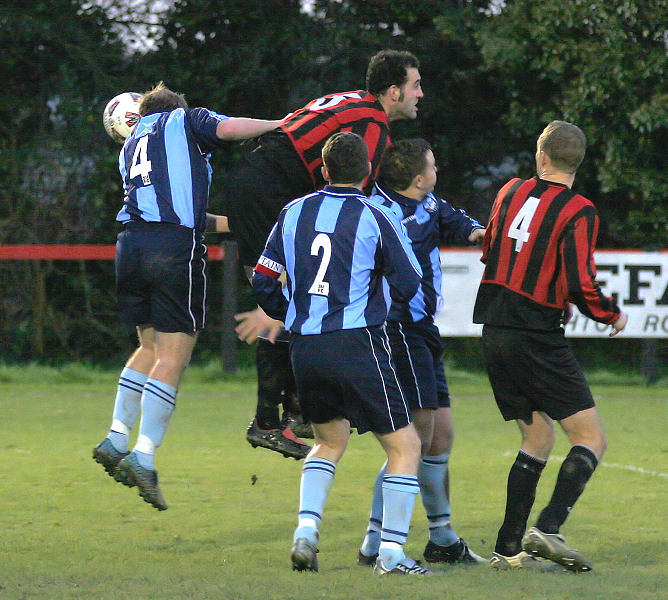 Chris Steward (4) and Pete Christodoulou (5) watched by Owen Ball (2) and Paul Hodder (4)
