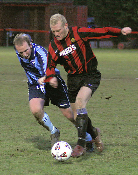 Kane Evans is shadowed by Chris Steward
