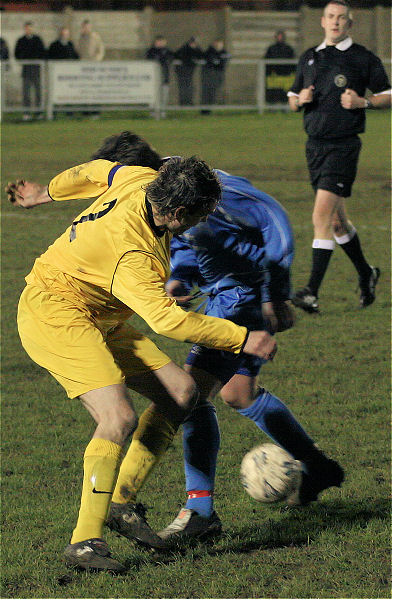 Andy Lutwyche (2) gets in a tackle
