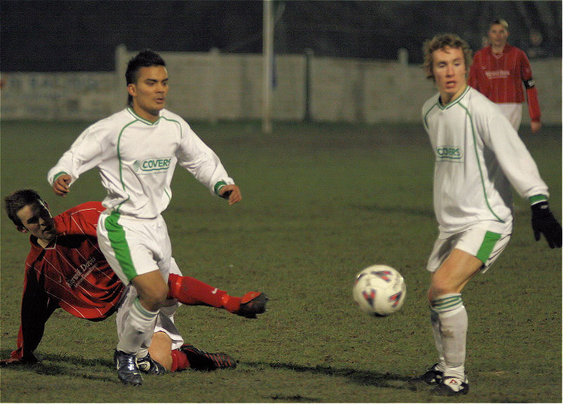 Chris Green squeezes the ball away from Belal Miah and Matt Smith
