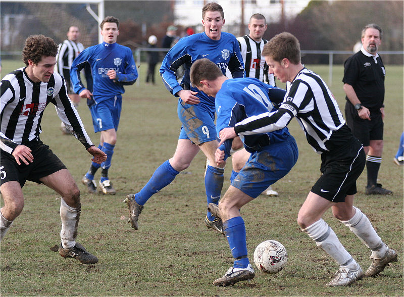 Mike Hatch (10) is challenged by Ashley Jones (4)
