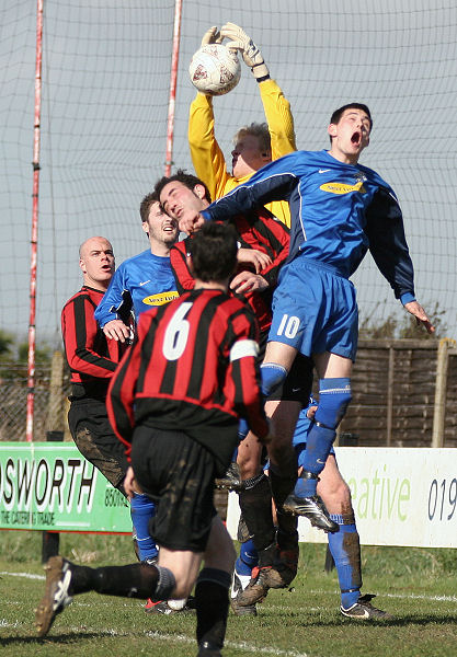 Tom Rand catches a cross under pressure from Sonny Banks and others
