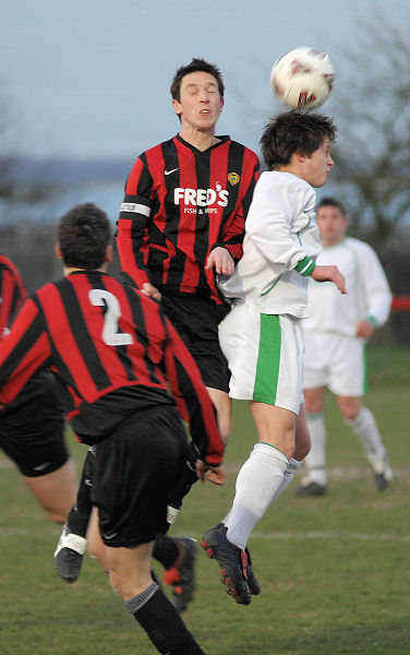 Dave Sharman beats Scott Murfin for a header
