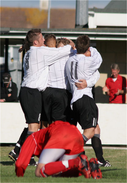 ... and Josh is mobbed by his team mates
