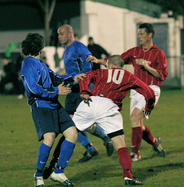 Matt Huckett nicks the ball past Kieron Howard

