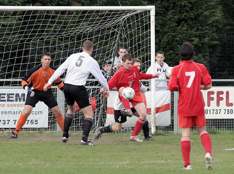 Robbie Burns tries to turn but Chris Yelling stops him
