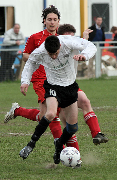 Sonny Banks brings the ball away from Jamie Sinclair and Stephen Gillett
